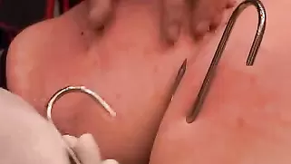 Master Sticks Sharp Hooks In Her Massive Boobs And Ass