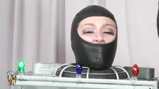 Hooker Masked And Trapped Inside A Torture Device