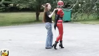 Pretty Slave With Big Tits In Tight Latex Costume Walks Around On High Heels